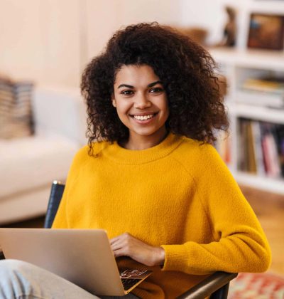 image-of-african-american-woman-using-laptop-while-LEQZJET.jpg